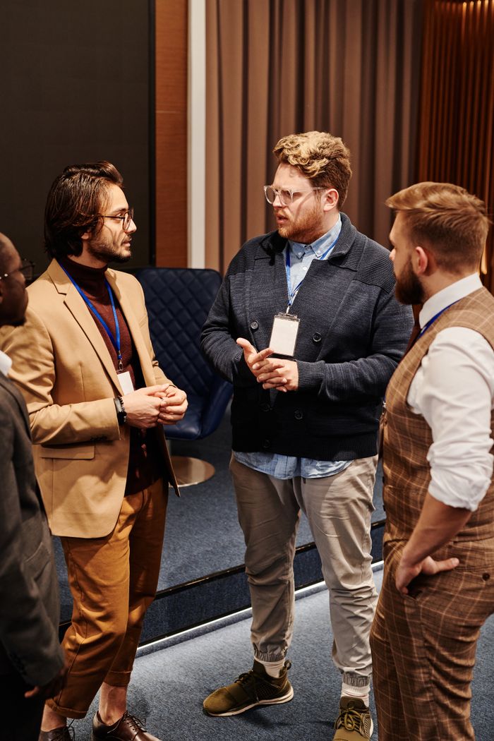 The Art of Drawing Readers In: Your attractive post title goes here Group of diverse professionals discussing work strategies at a business meeting.
